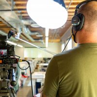 Gordon Howell of Archer & Hound looking at his interviewee during a video shoot for a client