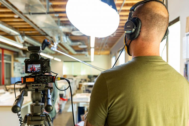 Gordon Howell of Archer & Hound looking at his interviewee during a video shoot for a client