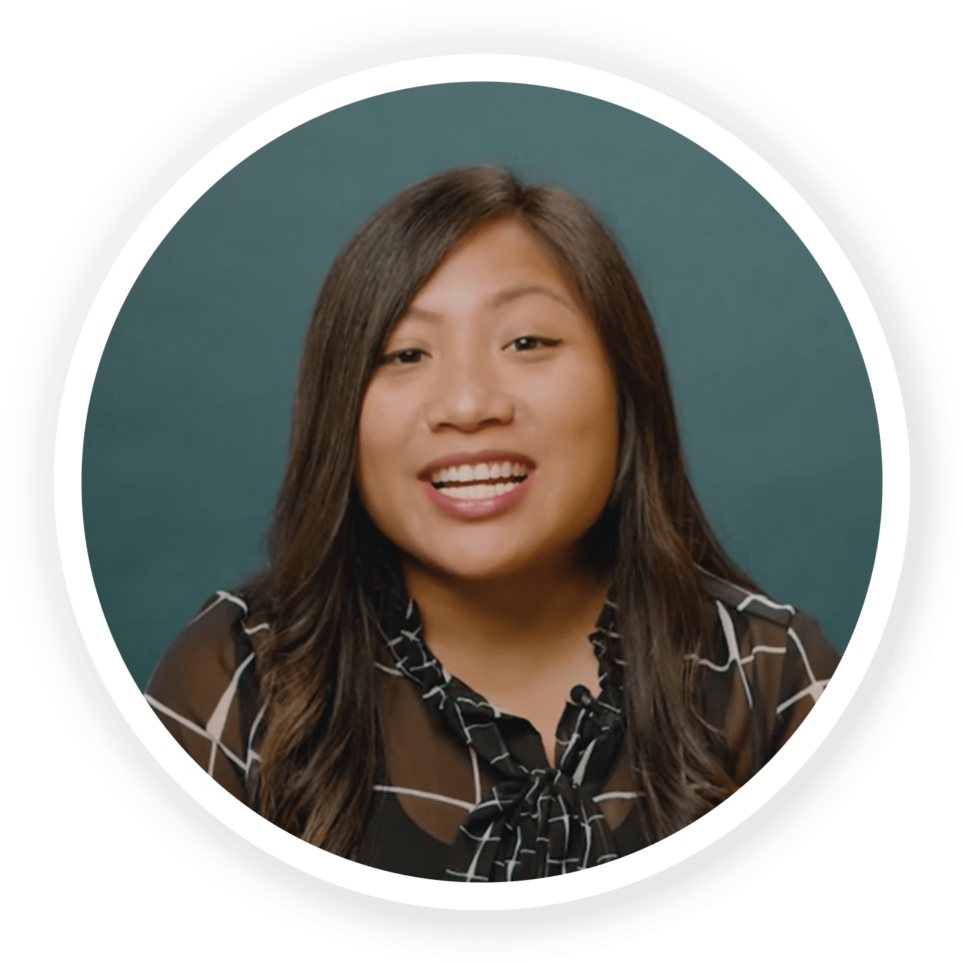 Profile of Aileen Pasión in a dark designed shirt on a dark blue-green background