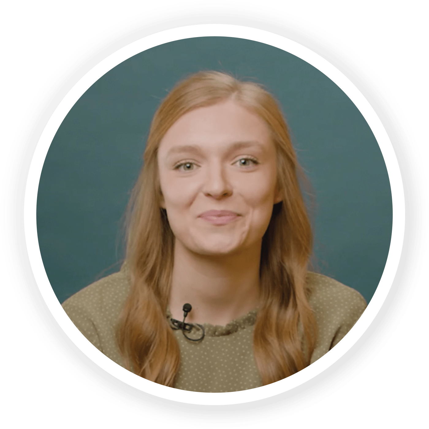 Profile of Kylie Insco in a green patterned shirt on a dark blue-green background